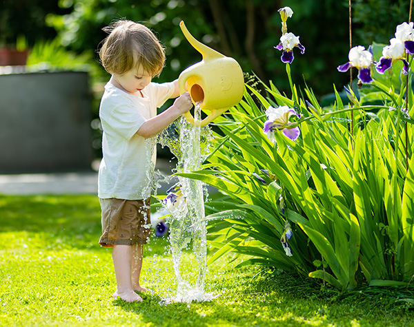 Kid with watering can