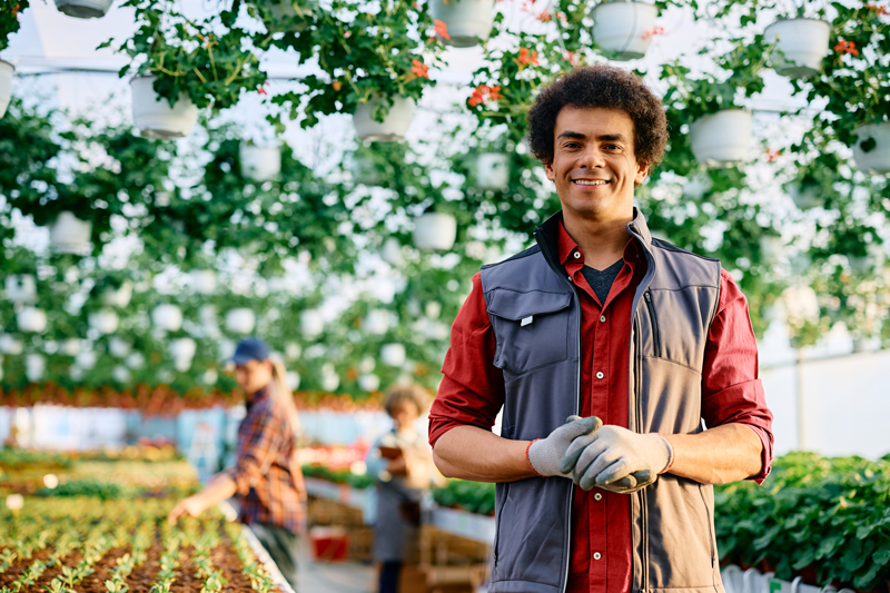 Suburban Garden Store Worker with plants around them